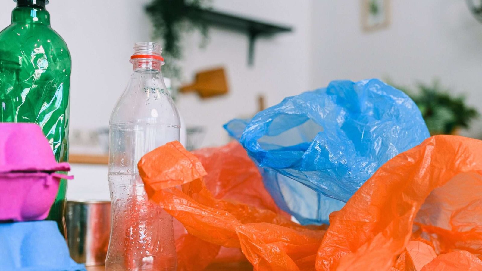 Assorted plastic waste on a wooden table